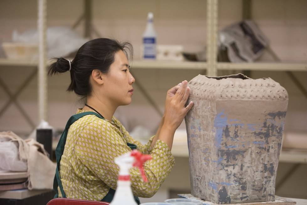 Woman creating ceramics